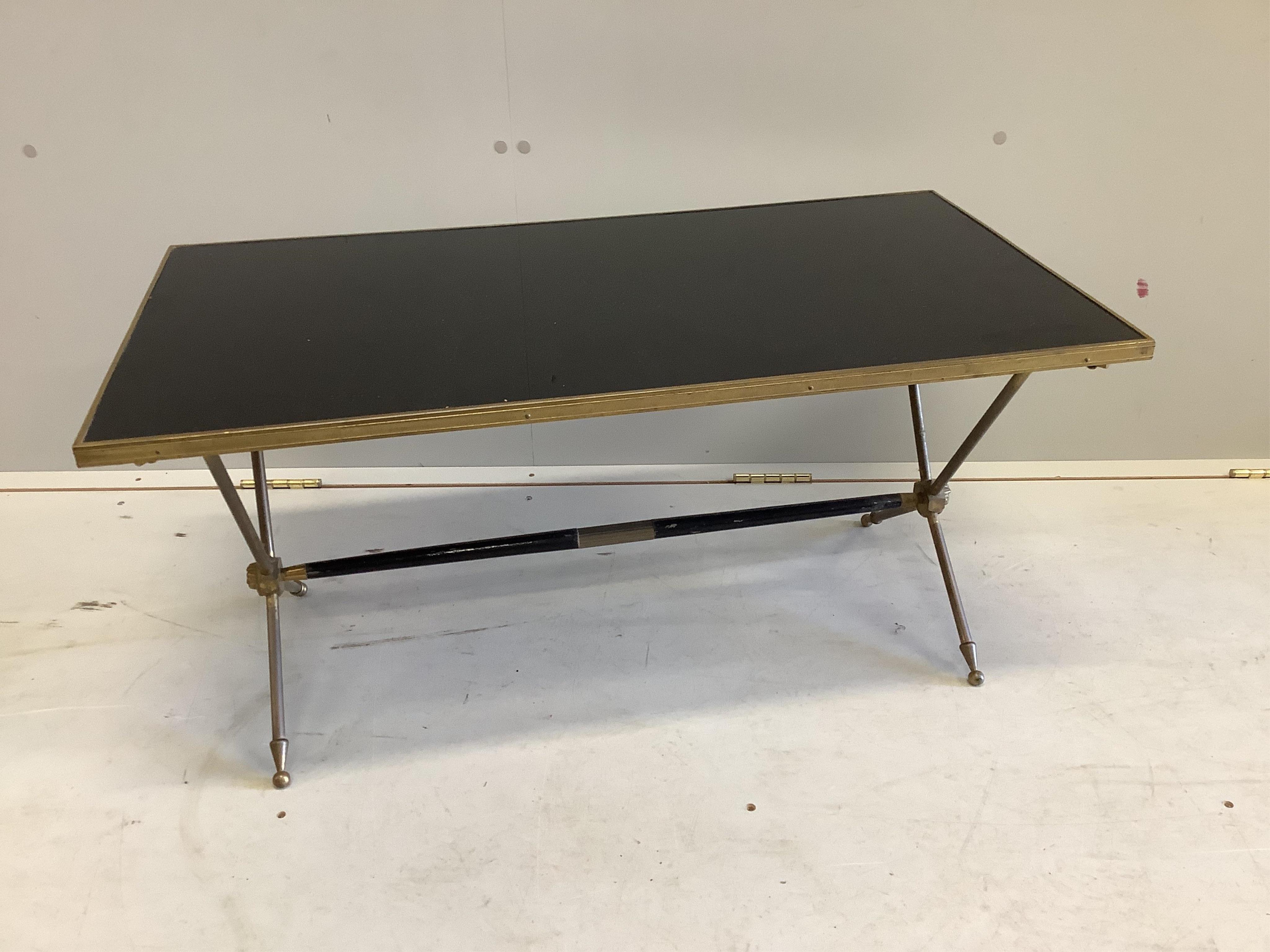 A Maison Jansen style brass and black laminate coffee table, width 85cm, depth 45cm, height 40cm. Condition - fair